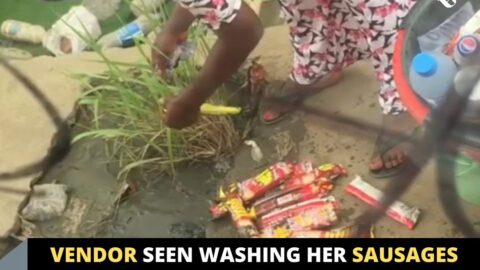 Vendor seen washing her sausages after it fell into a gutter in Ikeja, Lagos