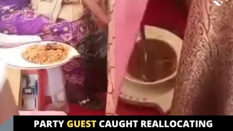 Party guest caught reallocating the meal she was served at an event