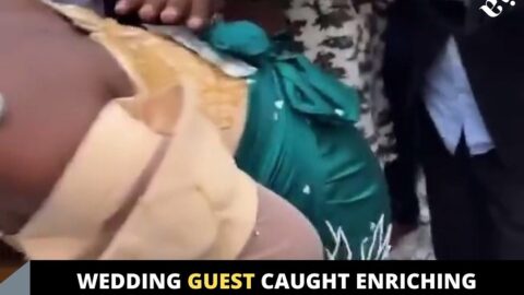 Wedding guest caught enriching himself with some dollars sprayed on the bride