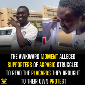 The awkward moment alleged supporters of Akpabio struggled to read the placards they brought to their own protest